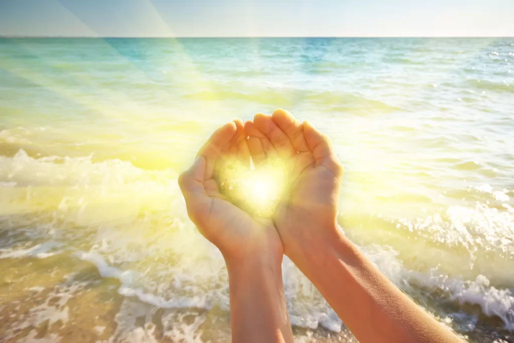 Heart symbol in feminine hand. Conceptual design.